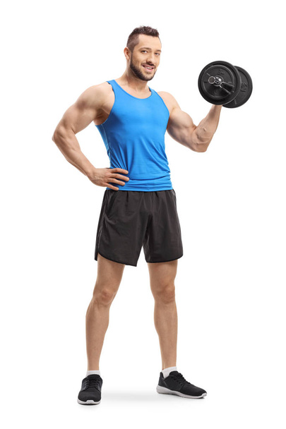 Man exercising bodybuilding with a dumbbell - Foto, Imagen