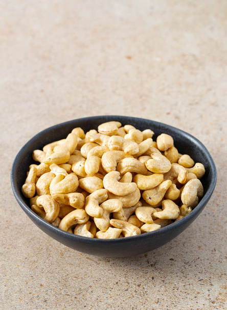 cashew nuts on granite surface - Fotografie, Obrázek