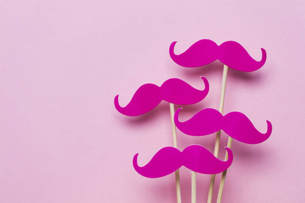Pink moustache on a pink background. Modern masculinity concept - Foto, Imagen