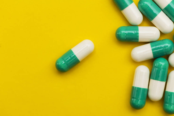 Prescription antibiotic drug medication pills on a bright colour - Photo, Image