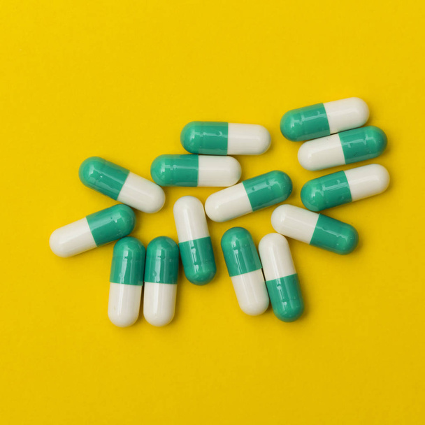 Prescription antibiotic drug medication pills on a bright colour - 写真・画像