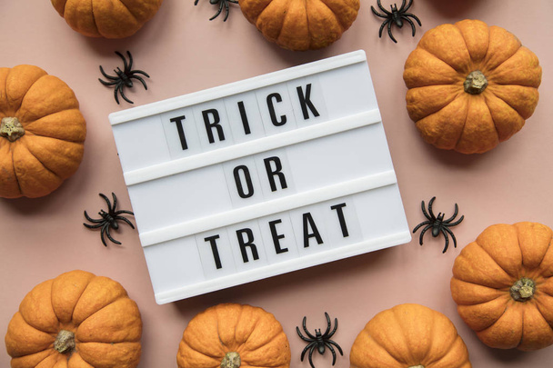 Trick or Treat halloween lightbox message with black scary bats - Foto, imagen