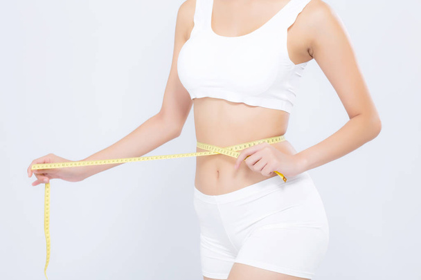 Azjatycka kobieta dieta i szczupła z pasa pomiarowego dla Weight ISOLAT - Zdjęcie, obraz