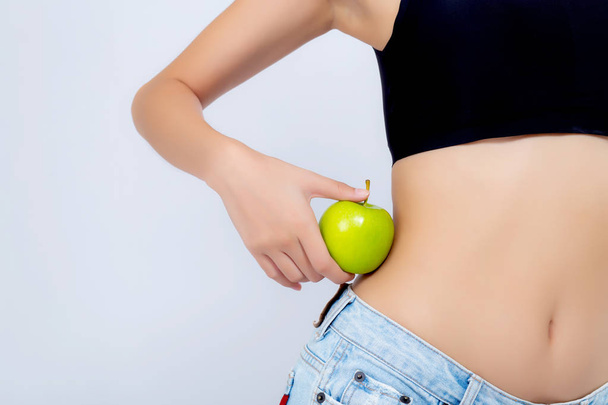 Beautiful body woman sexy slim holding green apple with cellulit - Фото, зображення