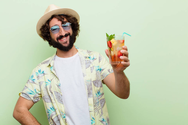young crazy bearded man with a cocktail. tourist concept - Foto, afbeelding