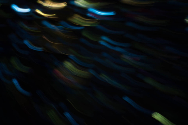 blur night festive lights neon blue yellow strokes - Photo, Image