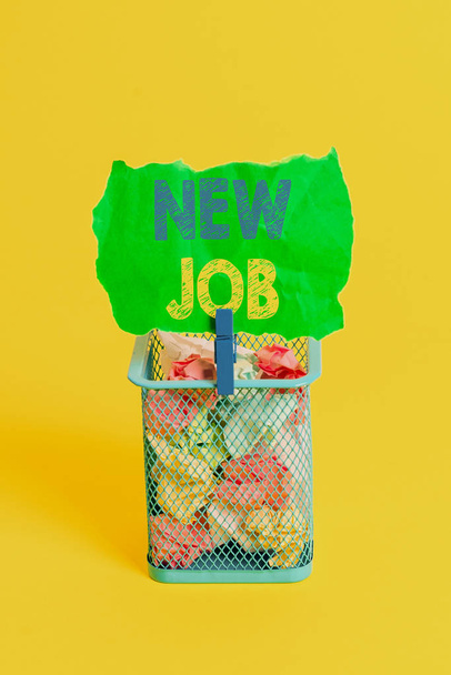 Word writing text New Job. Business concept for signing contract Finding work opportunity Seeking better salary Trash bin crumpled paper clothespin empty reminder office supplies yellow. - Photo, Image