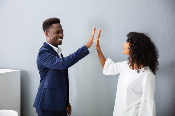 Businessman Giving High Five To His Colleague At Work - Photo, image