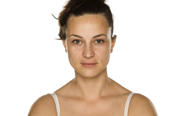 young woman without makeup on white background - Фото, изображение