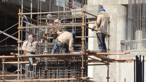 Men at Work In The Construction. Workers' scenes and activities of work in the construction - Materiał filmowy, wideo
