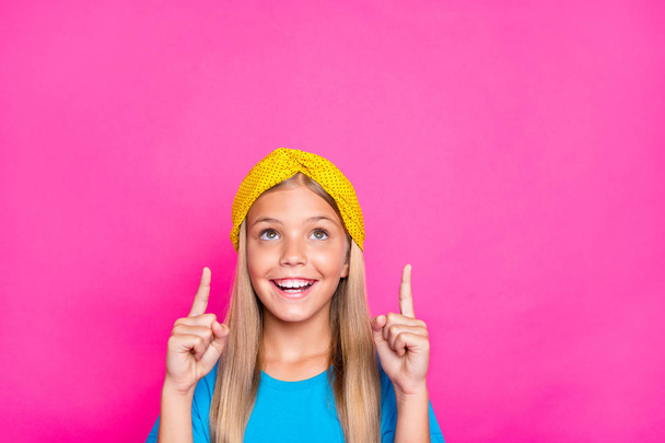 Close up photo of cheerful positive funny funky child point index finger indicate ads recommend her choice decision advice wear blue clothes isolated over pink color background - Foto, Imagem