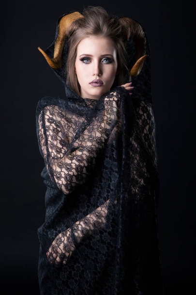 Portrait of an attractive demon woman with horns - Fotó, kép