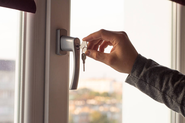How to Install a window lock for home safety. Window Lock How-To. Children Injury. - Photo, Image