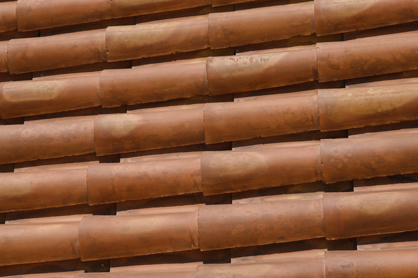 red tiles roof for background. Roof tiles closeup - Valokuva, kuva
