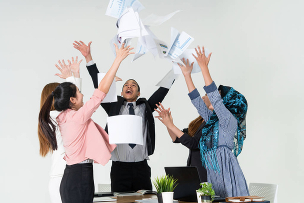Business people throwing papers in the office. - Foto, Imagem