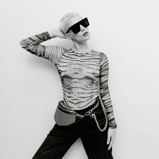 Swag Blonde Model in stylish glasses and clutch bag. Accessories - Zdjęcie, obraz