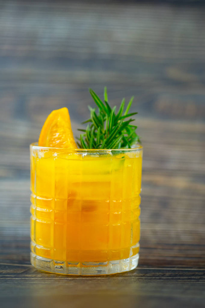 Freshly squeezed orange juice with ice cubes - 写真・画像