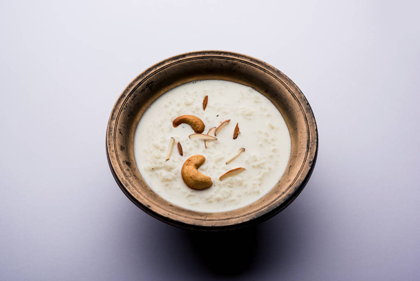 Rice Kheer or Firni or Chawal ki Khir is a pudding from Indian subcontinent, made by boiling milk ,sugar and Rice. Served in a bowl - Photo, Image