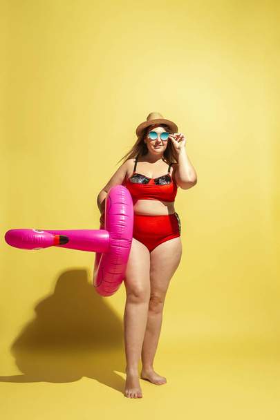 Young caucasian plus size female models preparing for beach resort - Photo, Image