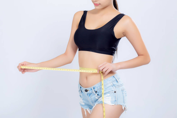 Closeup asian woman diet and slim with measuring waist for weigh - Photo, Image