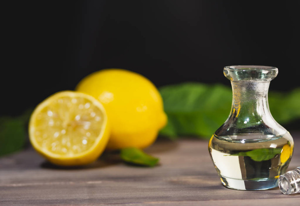 Lemon essential oil for massage and aromatherapy, copy space image - Foto, Imagem