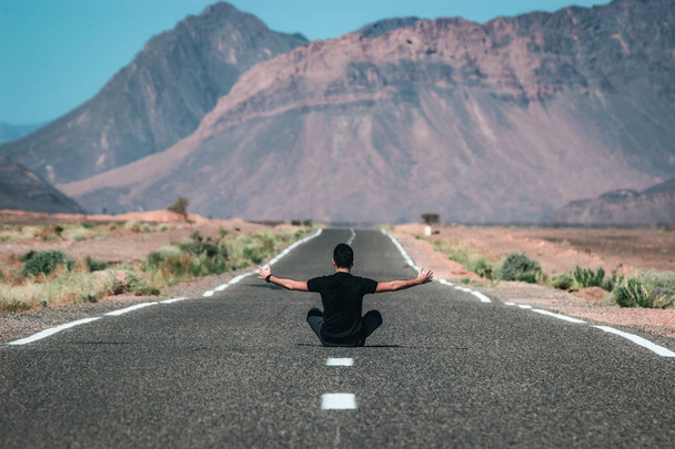 Boy in the middle of the road. Incredible landscape in Morocco, adventure travel in Africa - Zdjęcie, obraz
