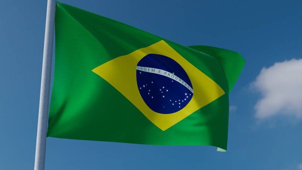 Brazil nemzeti zászló integetett a szél kék ég háttérben - Fotó, kép