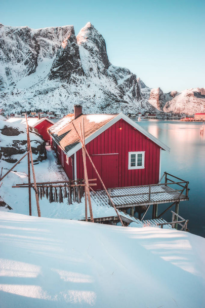 house on the lake in the mountains, fishing village of Reine, Lofoten Islands - Norway - Foto, afbeelding
