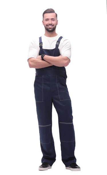 side view. smiling man in overalls looking forward to copy space - Foto, Imagem