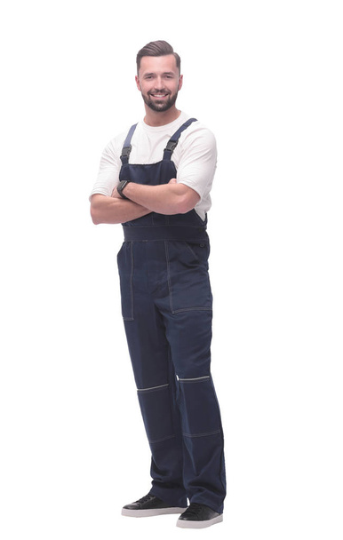 side view. smiling man in overalls looking forward to copy space - Foto, imagen