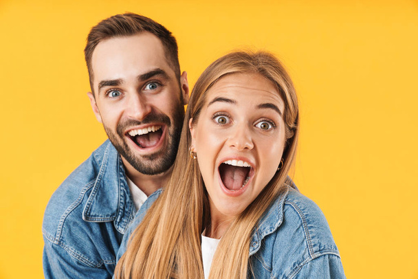 Image closeup of excited couple in denim clothes screaming at camera - Foto, immagini