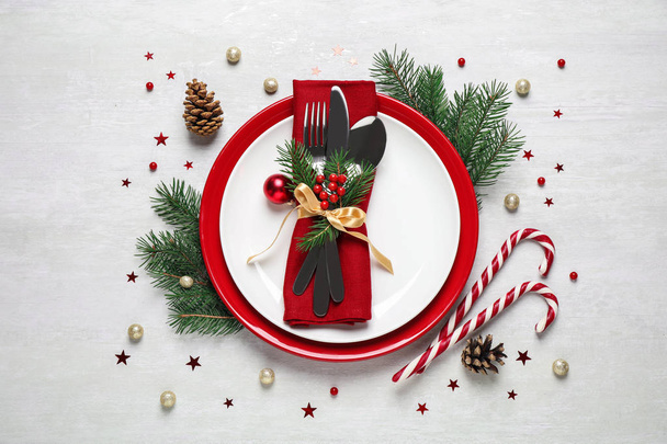 Christmas table setting on white background, flat lay - Foto, imagen
