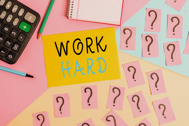 Conceptual hand writing showing Work Hard. Business photo text Laboring that puts effort into doing and completing tasks Mathematics stuff and writing equipment on pastel background. - Photo, Image