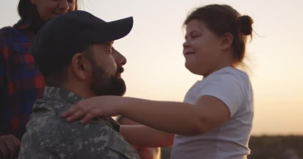 Wheelchaired soldier hugging his daughter - Footage, Video