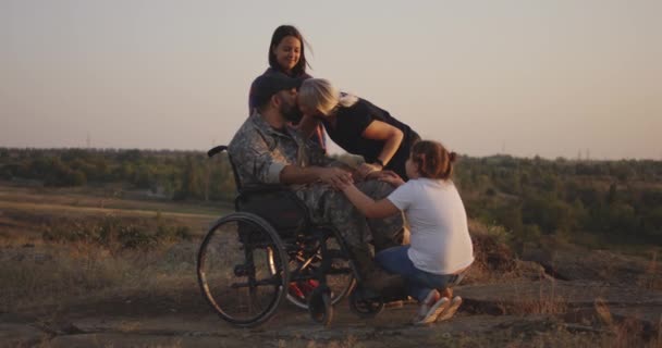 Wheelchaired soldier being together with family - Footage, Video