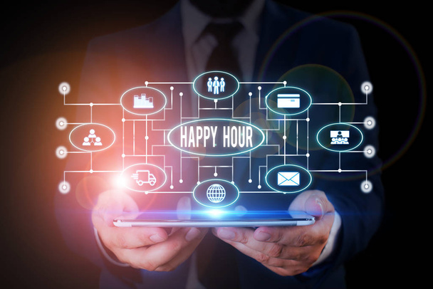 Handwriting text writing Happy Hour. Concept meaning Spending time for activities that makes you relax for a while Male human wear formal work suit presenting presentation using smart device. - Photo, Image
