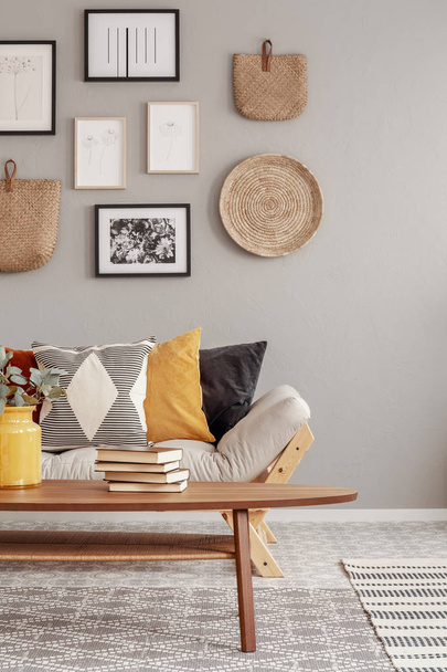 Beige scandinavian settee with patterned pillows in stylish living room interior - Valokuva, kuva