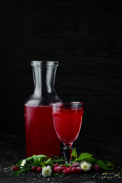 Fresh Morse of Cranberry Berries In a glass. Top view. On a black background. - 写真・画像
