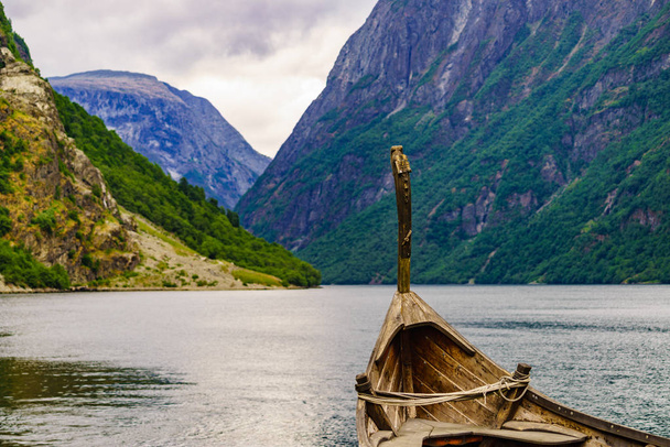 Old viking boat on fjord shore, Norway - Foto, afbeelding