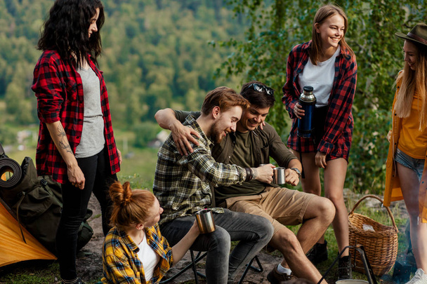 positive friends toasting outdoors at a picnic - Fotografie, Obrázek