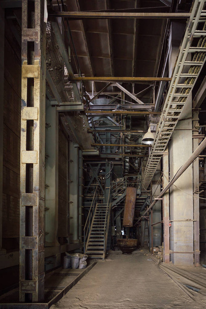 Inside of old abandoned factory. Rusty ruined industrial equipme - Fotó, kép