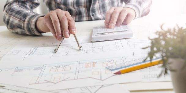 Architects working on blueprint, real estate project. Architect workplace. Construction concept. Engineering tools. - Φωτογραφία, εικόνα