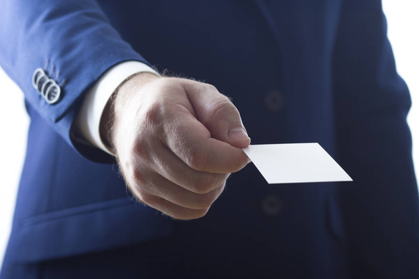 Hand holding white business card on white background - Zdjęcie, obraz