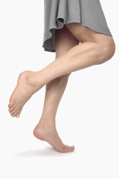 Woman legs and feet isolated over white - Foto, afbeelding