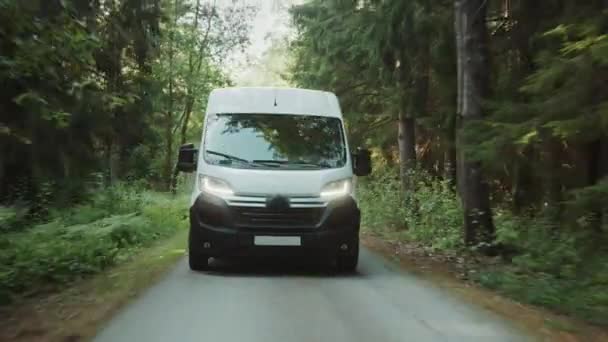 New Delivery Van / Truck Driving Through the Green Woods. Postal Delivery Service. Front View Following Shot - Кадры, видео