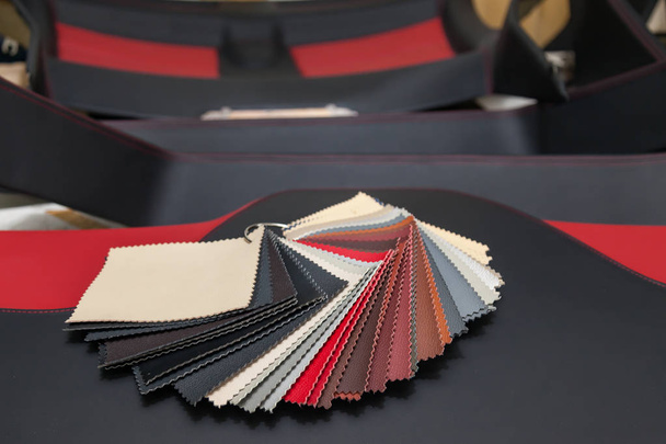 A catalog with samples of genuine leather materials in different - Photo, Image