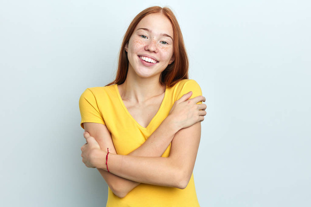 Closeup portrait of funny crazy positive smiling woman hugging herself - Photo, Image