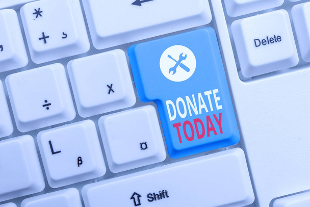 Conceptual hand writing showing Donate Today. Business photo text time to give money or goods to help a demonstrating or organization Keyboard with note paper on white background key copy space. - Photo, Image