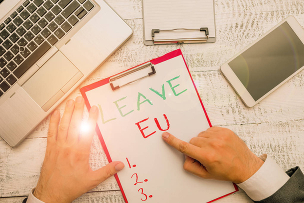 Conceptual hand writing showing Leave Eu. Business photo showcasing An act of a demonstrating to leave a country that belongs to Europe. - Photo, Image