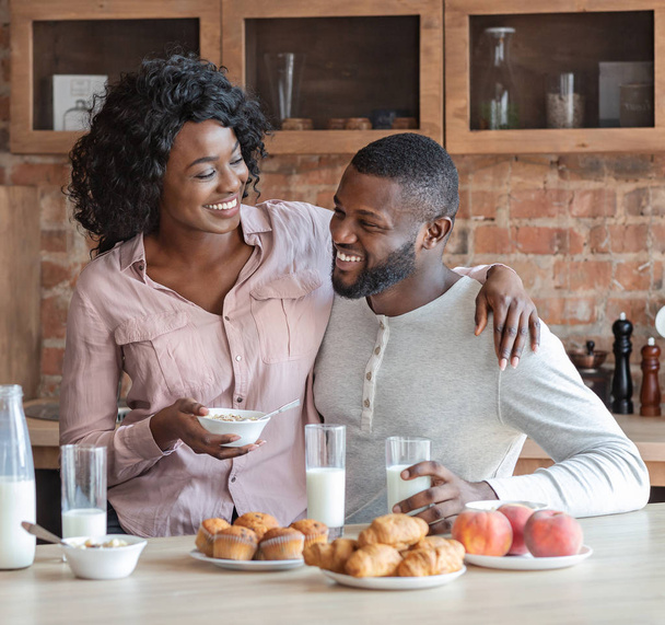 African married couple having breakfast together at home - Photo, Image
